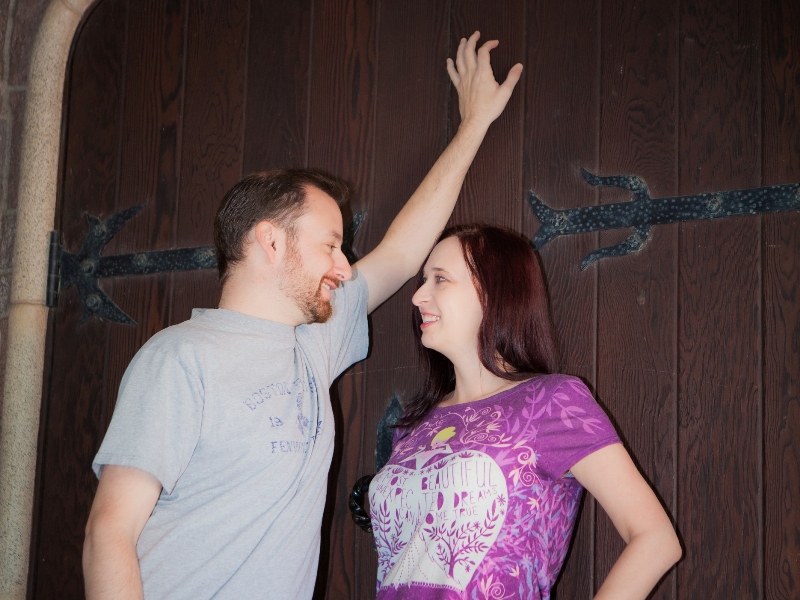 Couple posing inside Sleeping Beauty Castle at Disneyland