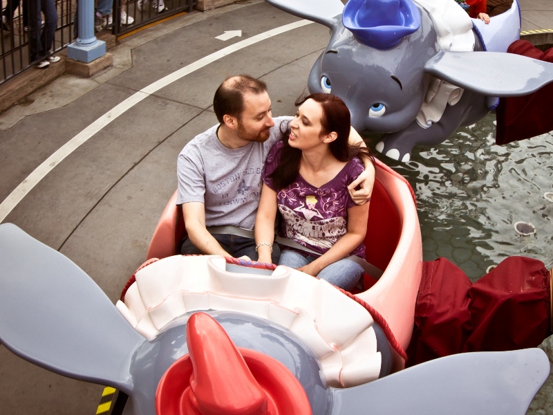 Couple riding Dumbo attraction at Disneyland