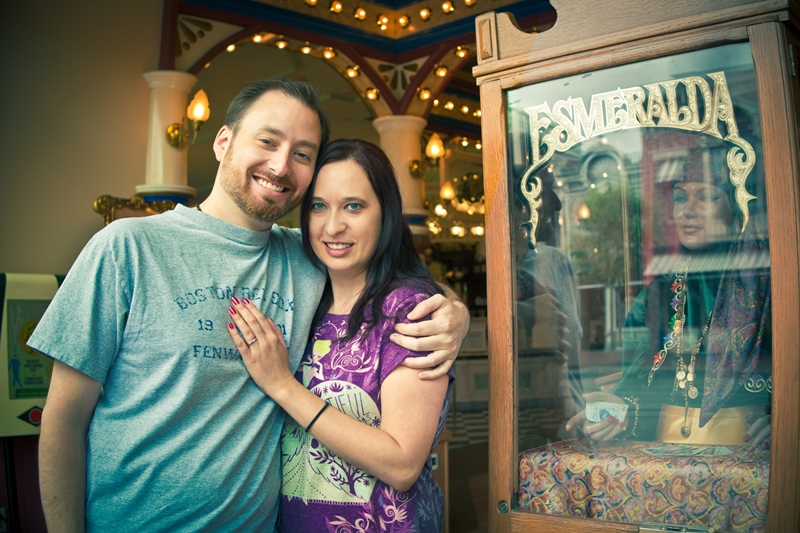 Couple posing by Esmeralda fortune teller machine