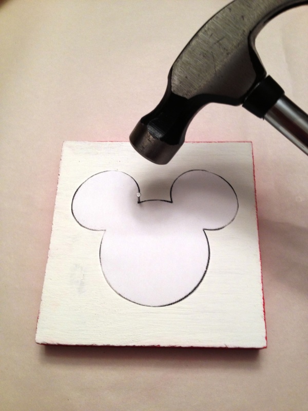 Wood block with Mickey shape template and hammer