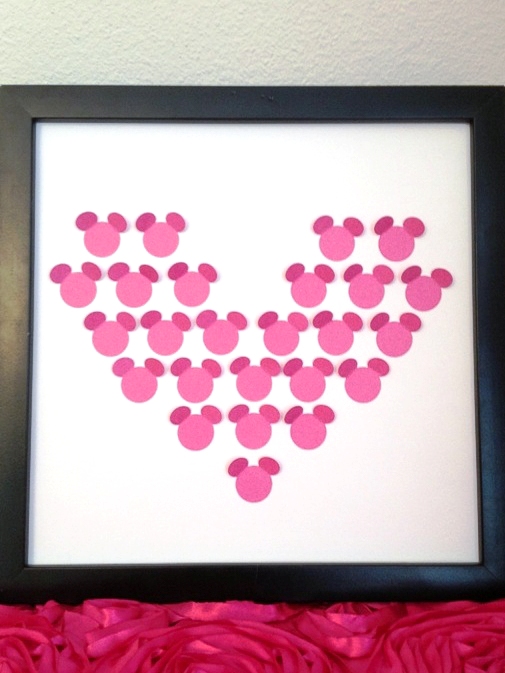 Heart made with paper Mickey shapes