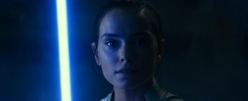 Rey with blue lightsaber in STAR WARS: THE RISE OF SKYWALKER