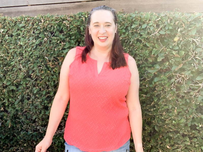 Woman wearing coral tank top