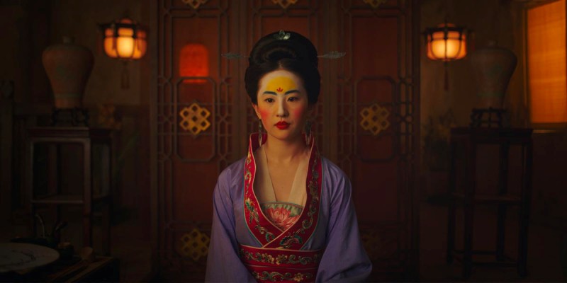 Mulan dressed in purple robe and makeup