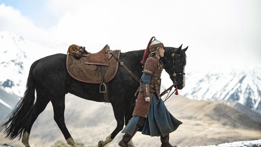 Mulan in warrior armor, walking alongside her black horse