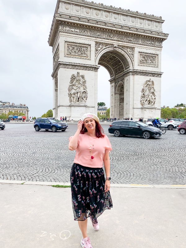 Woman in front of Arc de Triumph