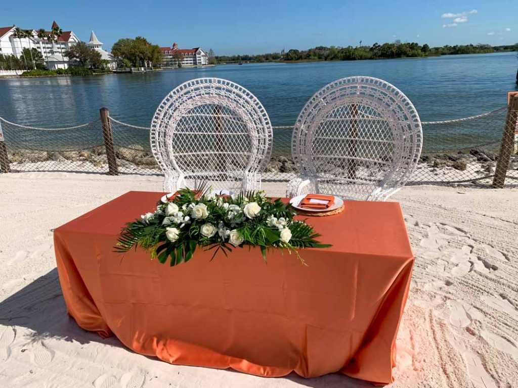 Close up of wedding head table on the beach