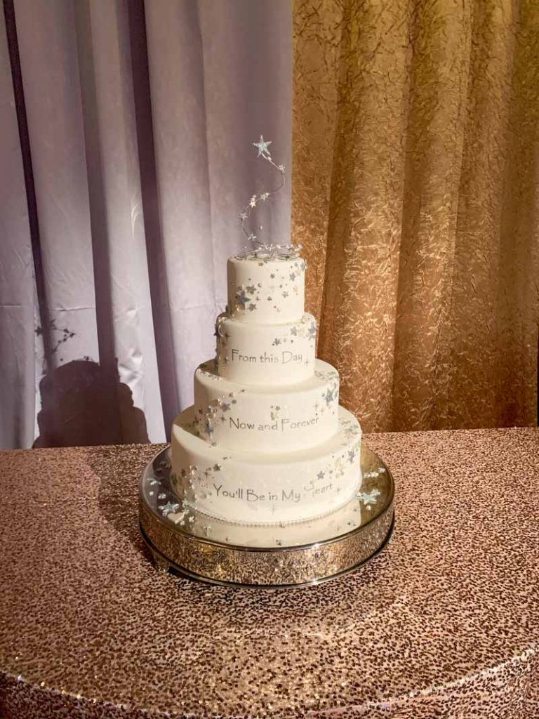 White wedding cake with four tiers and silver icing