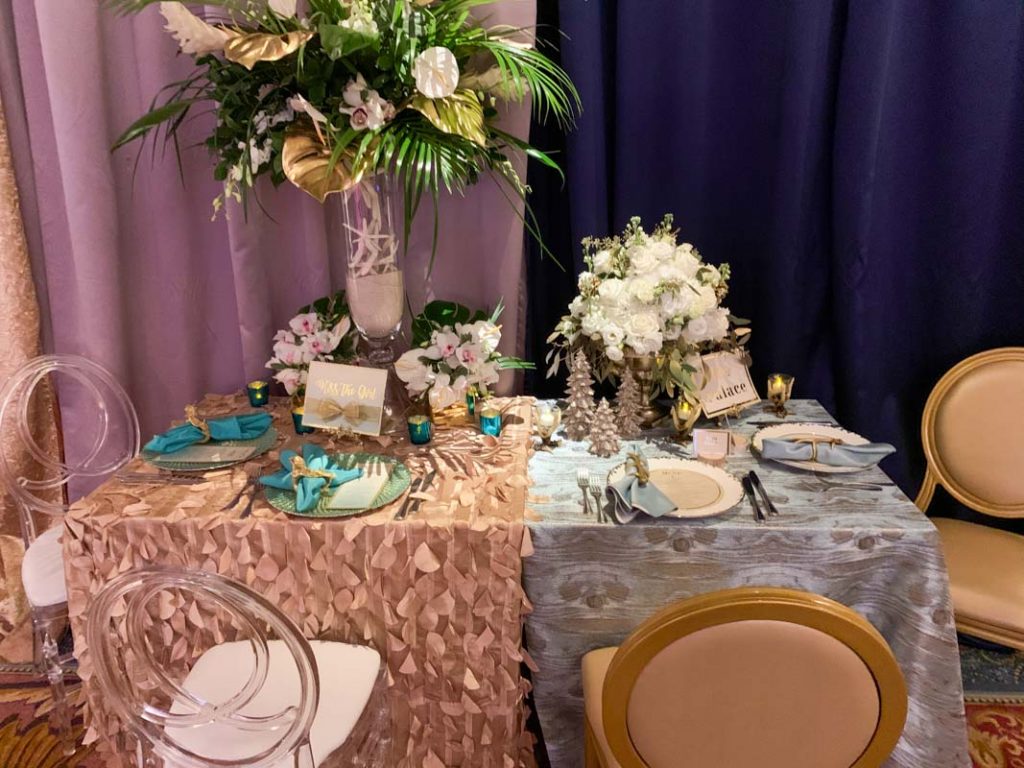 Sample wedding reception table with two different decor themes