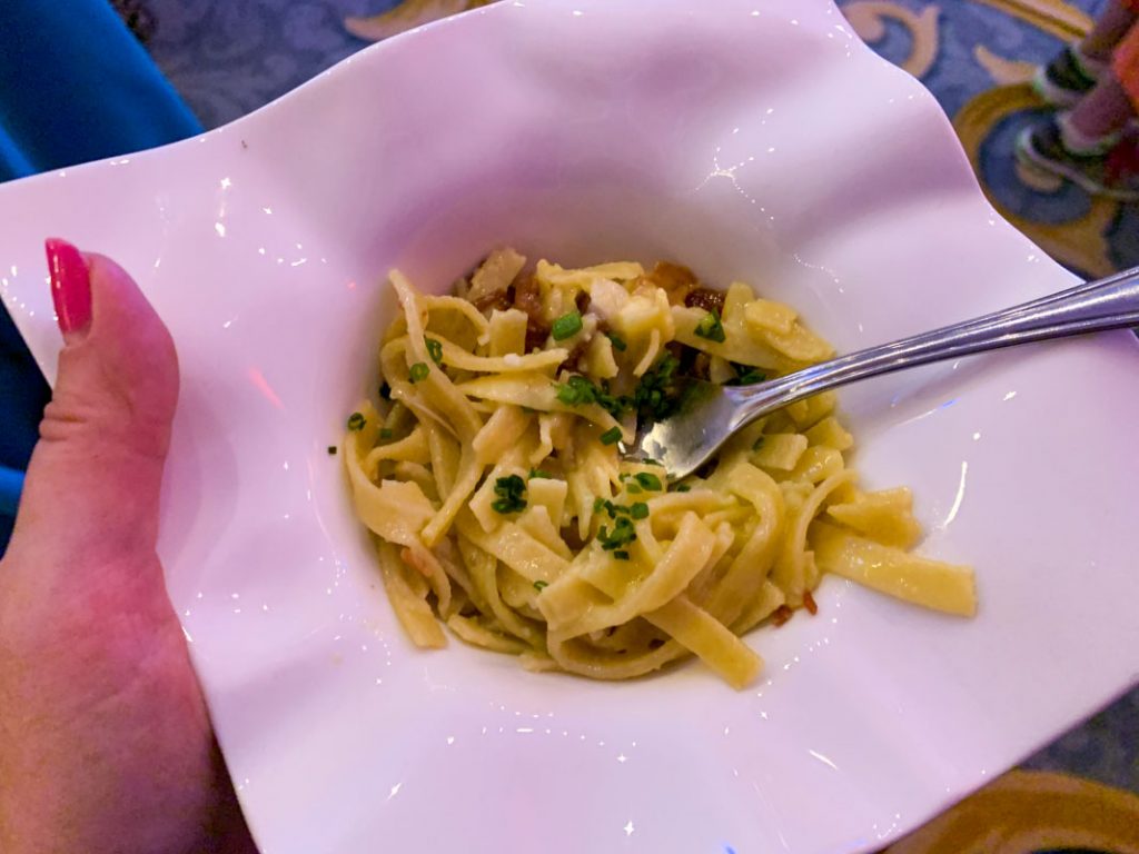 small serving of pasta in white bowl