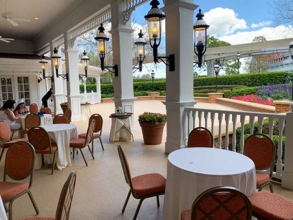 Patio at Disney's Grand Floridian Hotel with small tables and chairs