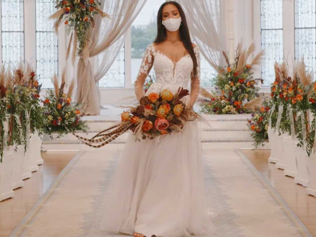 Woman wearing wedding gown inspired by Pocahontas