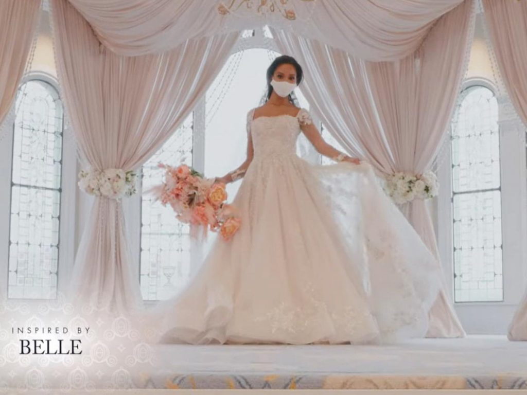 Woman wearing wedding gown inspired by Belle