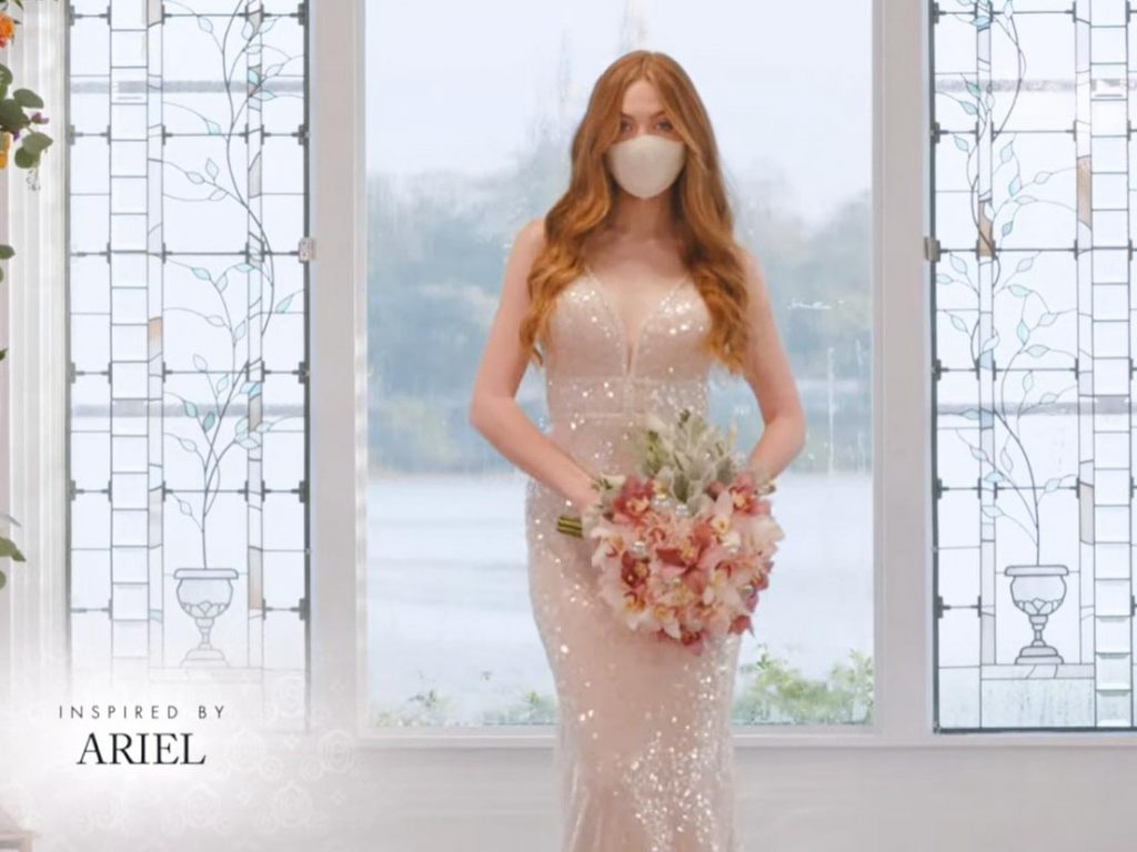 Woman wearing wedding gown inspired by Ariel