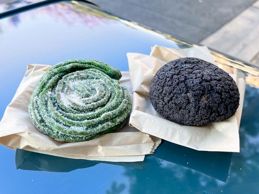 Green spiral churro and purple cream puff from Terran Treats