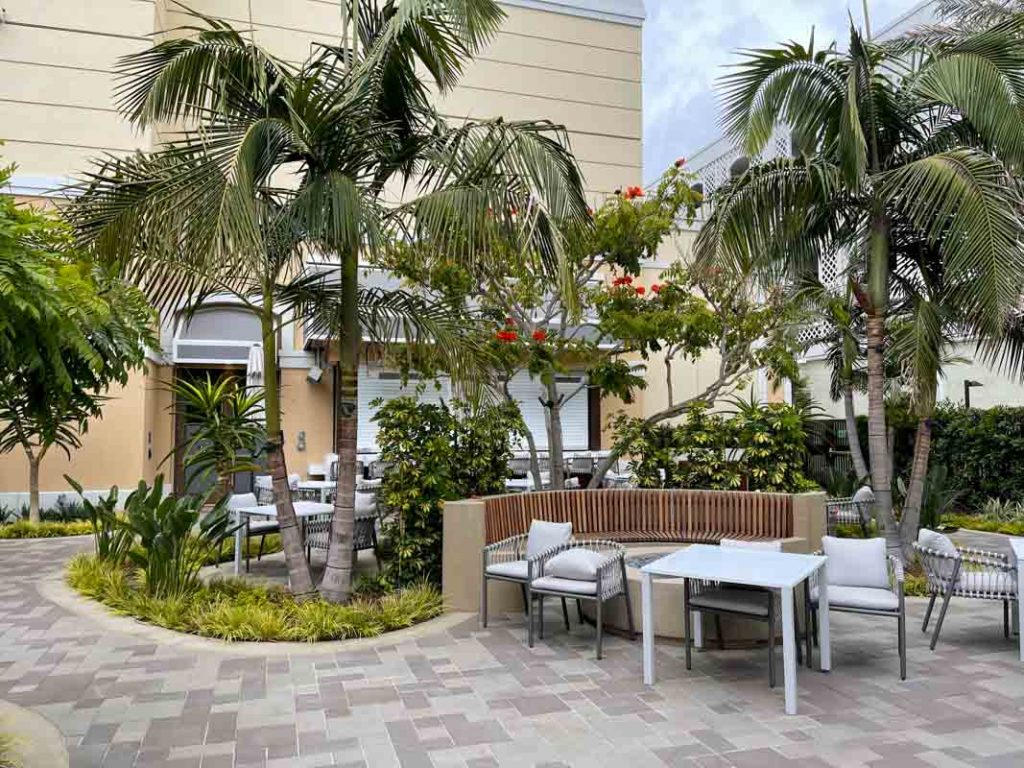 Wide shot showing extended seating area at Bella's Splash Pool Bar at Westin Anaheim