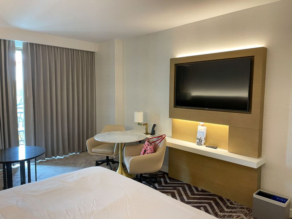 Interior of Westin Anaheim hotel room showing TV and table and chairs 