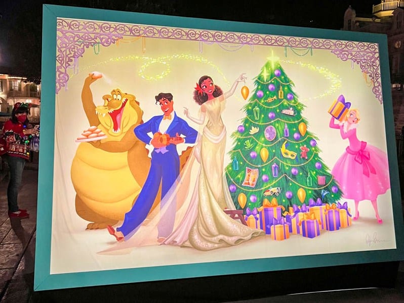 Light up mural depicting characters from The Princess and the Frog decorating for Christmas