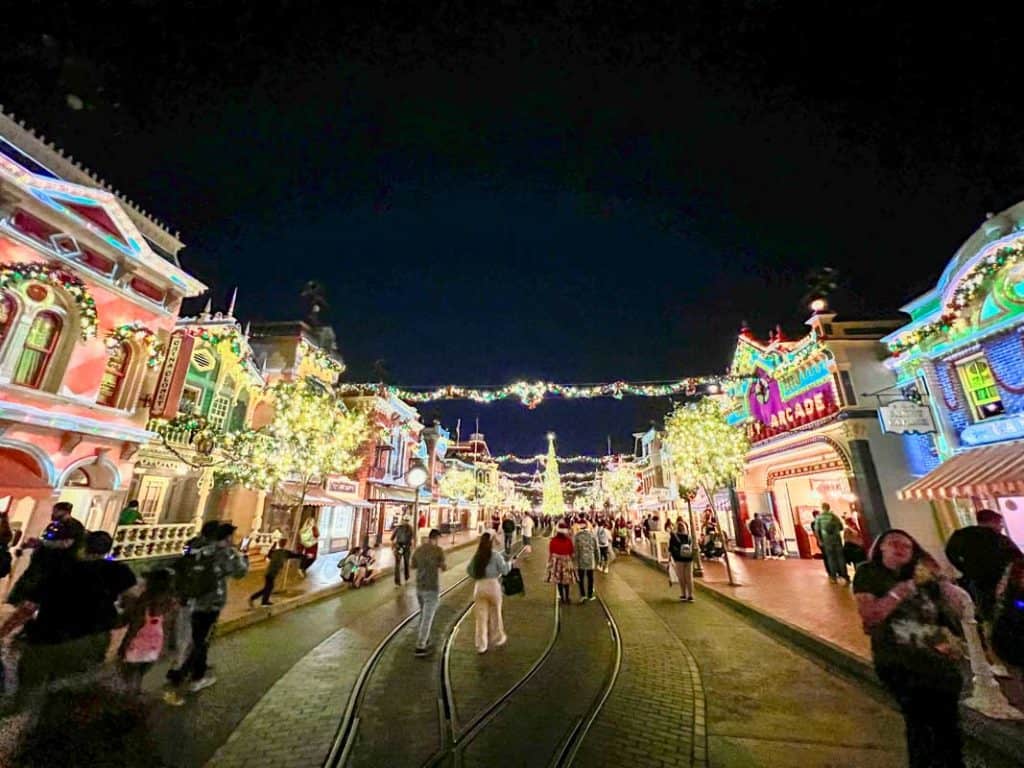 Wide angle view looking down Main Street USA at Disneyland during Merriest Nites
