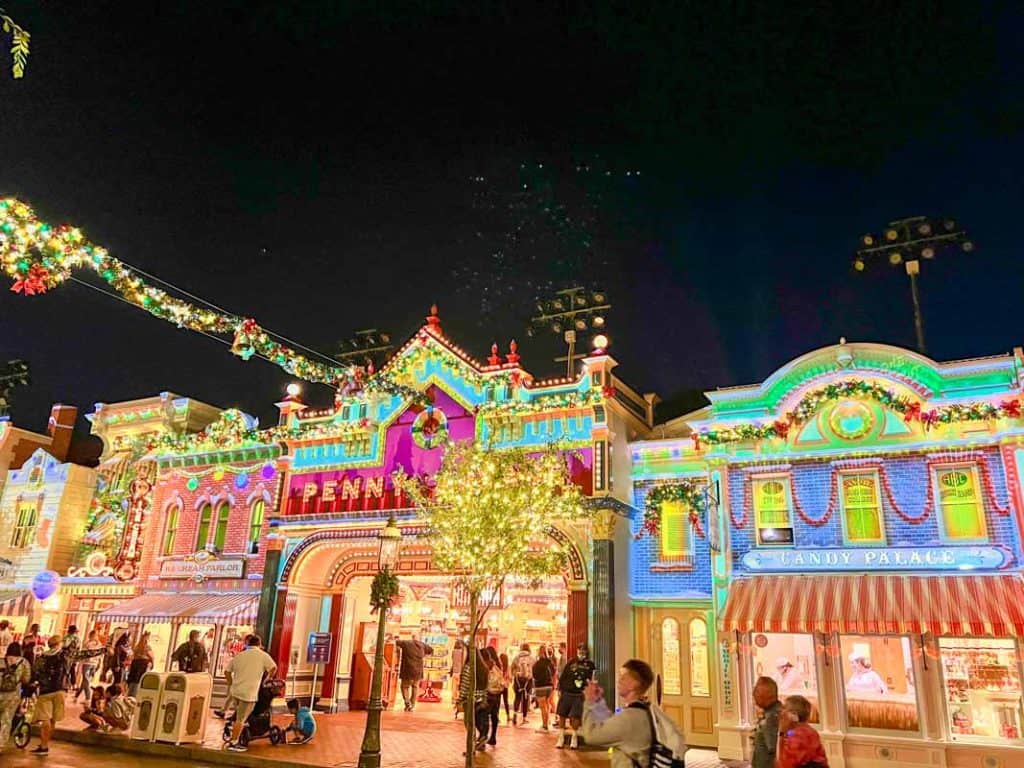 Projection mapping lights on the facades on Main Street USA during Merriest Nites