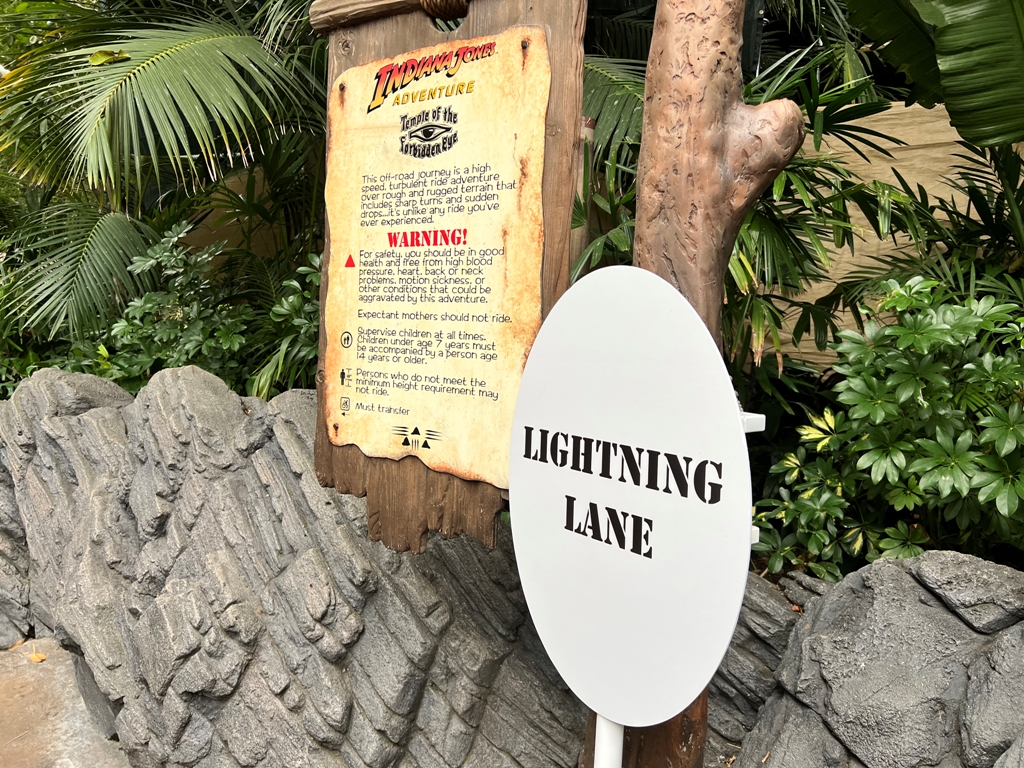 White Sign that reads "Lightning Lane" outside of Indiana Jones Adventure at Disneyland