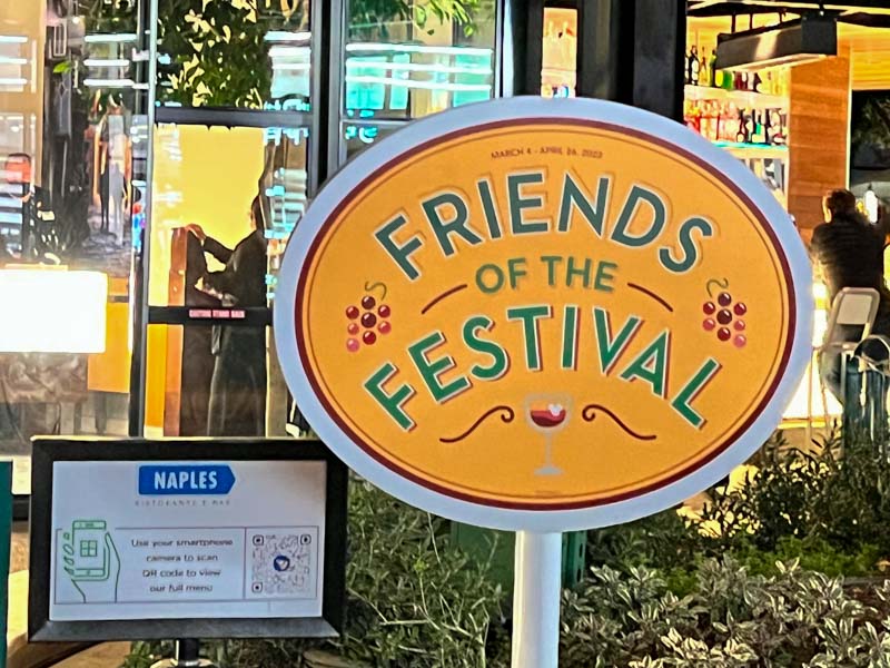 Yellow oval sign that reads "friends of the festival"