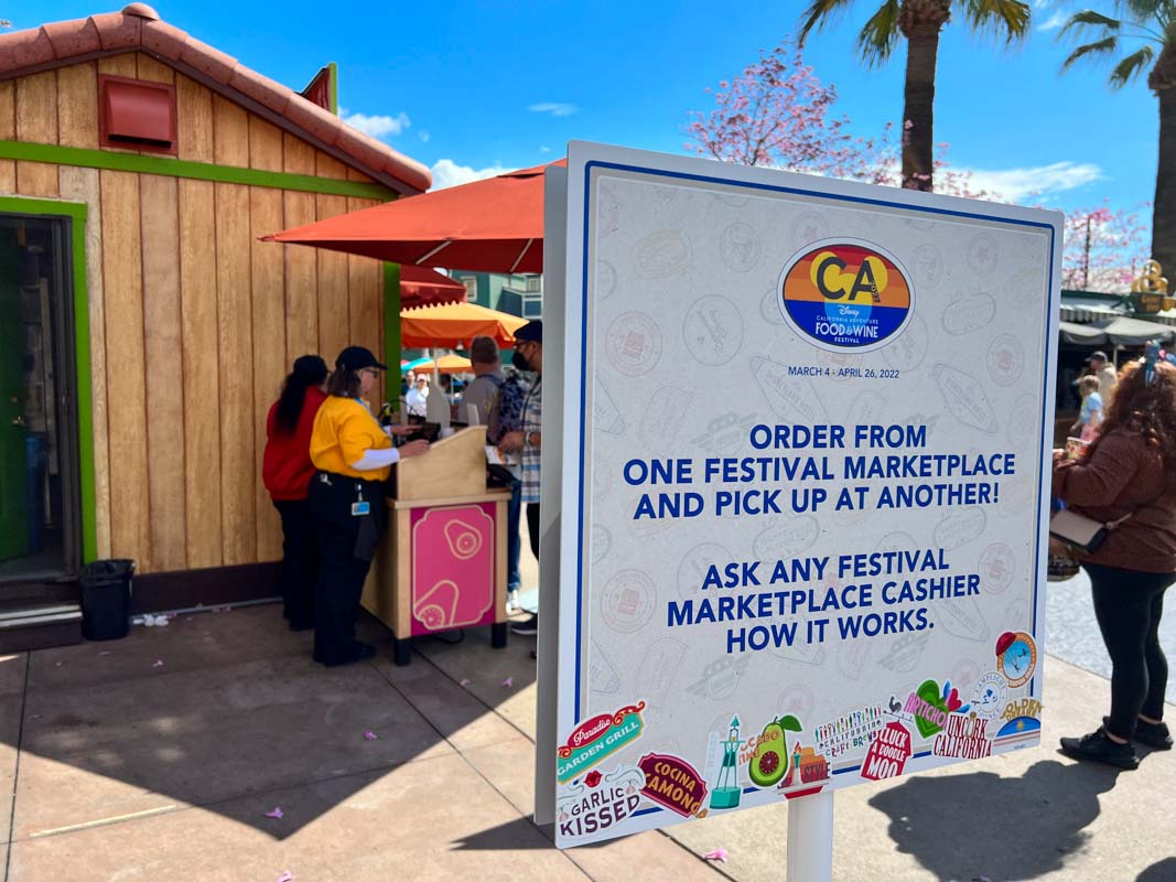 White sign directing Guests to order all their food from one marketplace