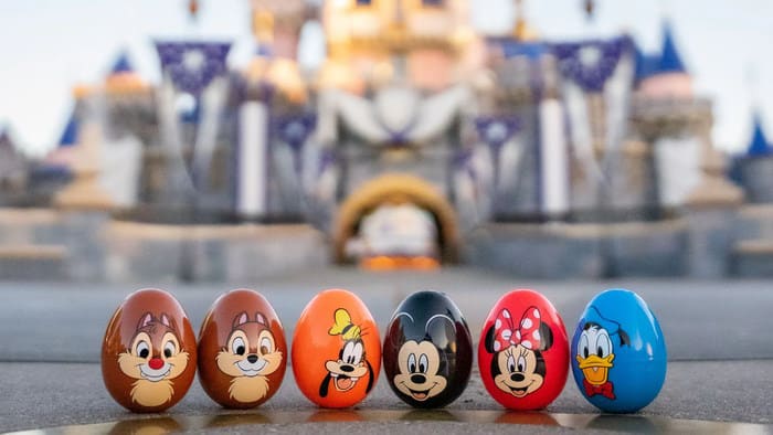 Row of 6 plastic eggs decorated with Disney characters