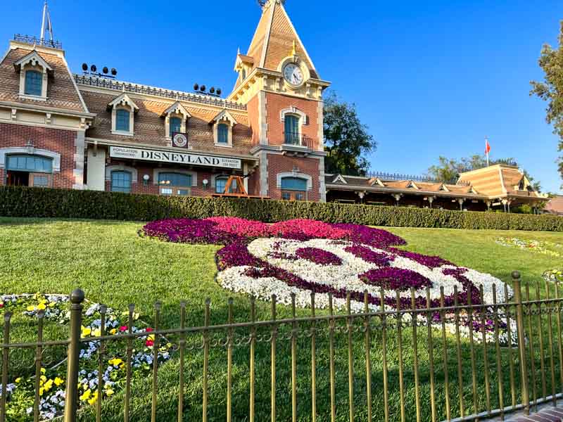 Floral Minnie in front of the Disneyland train station