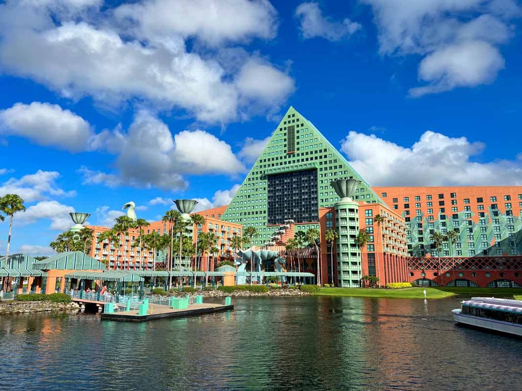 Exterior of Swan and Dolphin hotel showing boat dock and Crescent Lake in the foreground