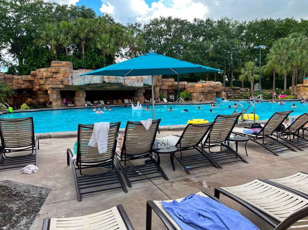 Grotto pool at Swan and Dolphin hotel, with guests enjoying the pool and loungers