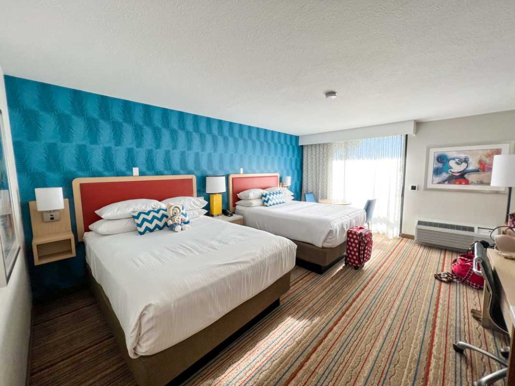 Interior of guest room at Howard Johnson Anaheim hotel showing two beds and window