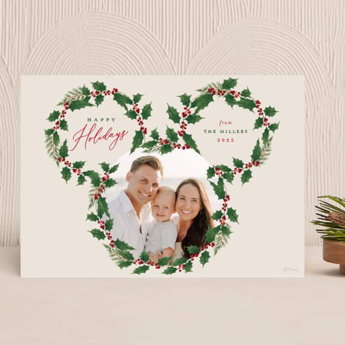 Holiday card with wreath design in shape of Mickey head with holiday photo inside