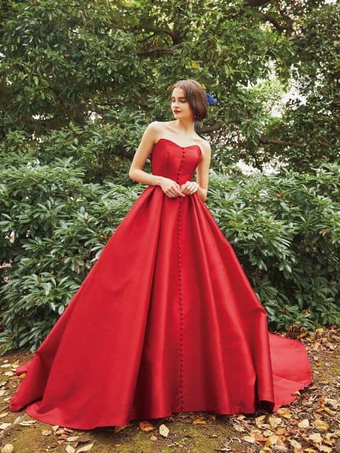 Woman wears red ballgown inspired by Snow White