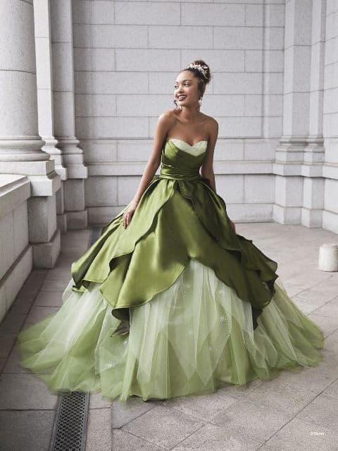 Woman wears dark and light green gown inspired by Princess Tiana