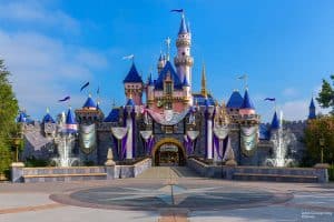 Concept art of Sleeping Beauty Castle decorated for Disney 100 celebration