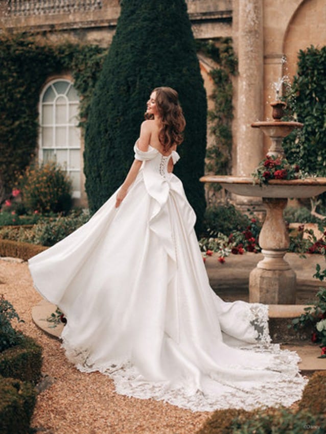 Model wears Belle inspired wedding dress