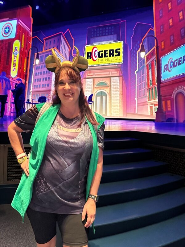 woman posing in front of stage at Disney California Adventure