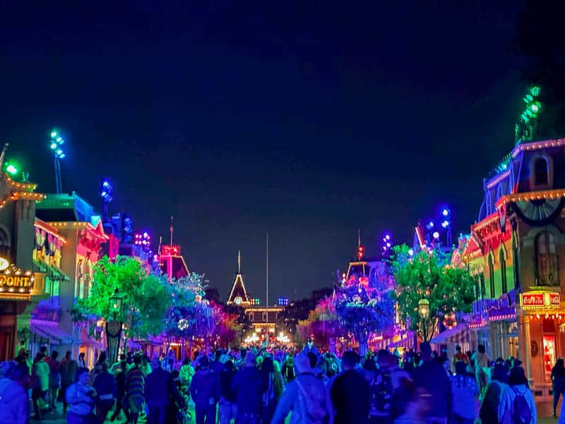 Main Street USA lit up with rainbow lights on Disneyland Pride Nite