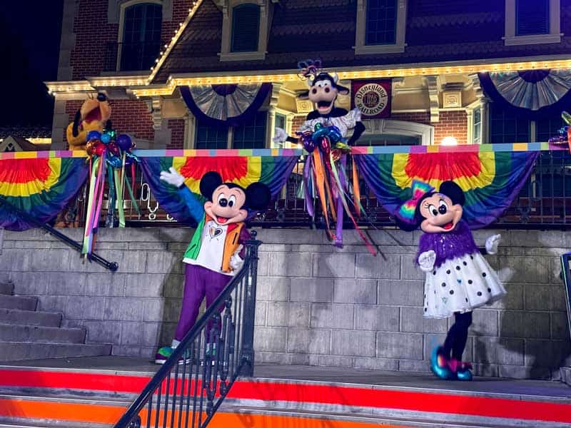 Mickey, Clarabelle, and Minnie wave goodbye to guests at Disneyland Pride Nite