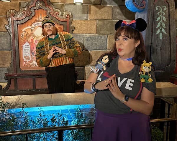 Woman poses with Oaken at Disneyland Pride Nite