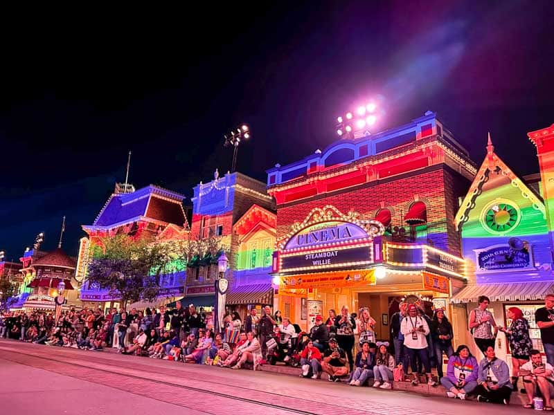 Main Street USA lit up with rainbow colors on Disneyland Pride Nite