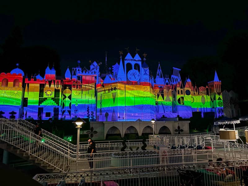 Small World lit up with rainbow colors on Disneyland Pride Nite