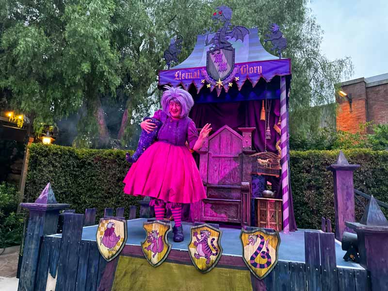 Madam Mim waves to guests at Oogie Boogie Bash.