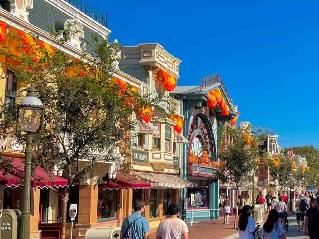 People walking down Main Street USA in Disneyland.