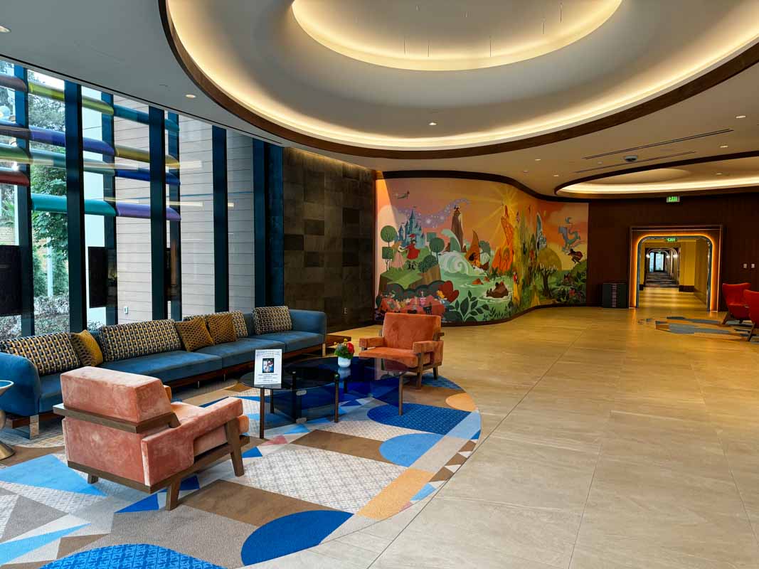 Lobby of The Villas at Disneyland Hotel showing seating area and mural