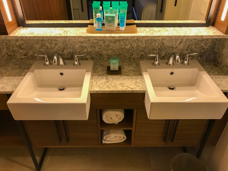 The bathroom area at Disney's Coronado Springs Resort with two sinks and a mirror.