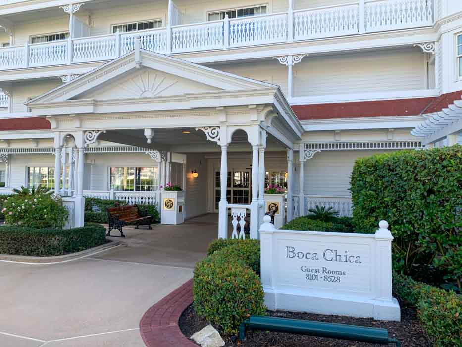 A white building at Grand Floridian Resort with sign outside that reads Boca Chica